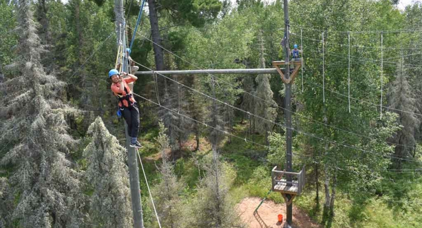 students make their way through a ropes course on an outward bound expedition 